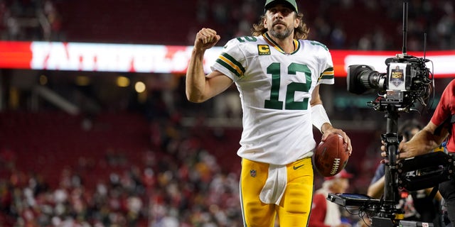 Green Bay Packers quarterback Aaron Rodgers runs into the locker room after the Packers beat the San Francisco 49ers 30-28 at Levi's Stadium.