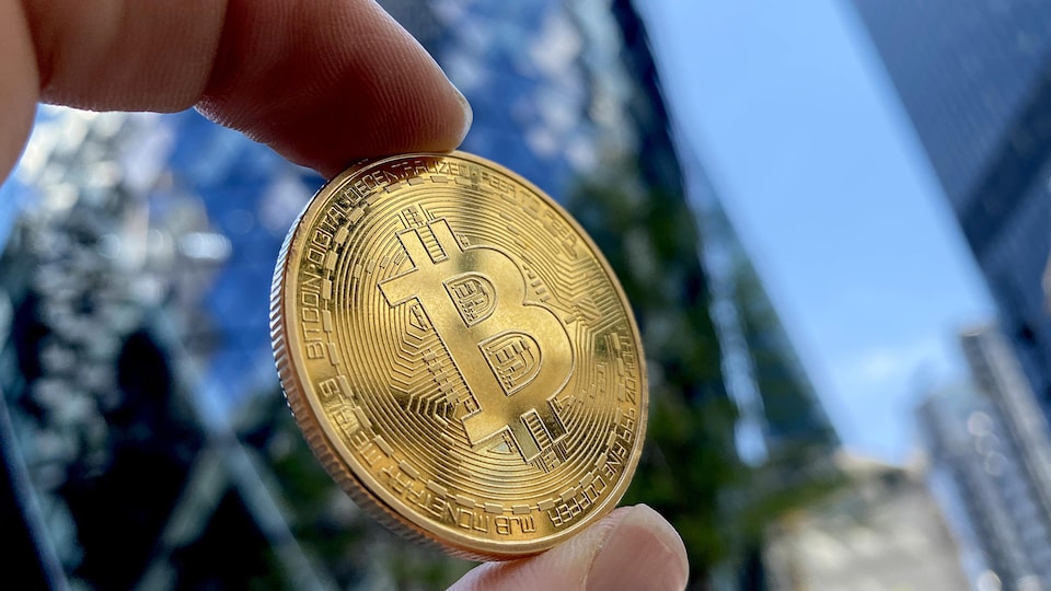 Coin bearing the Bitcoin logo.