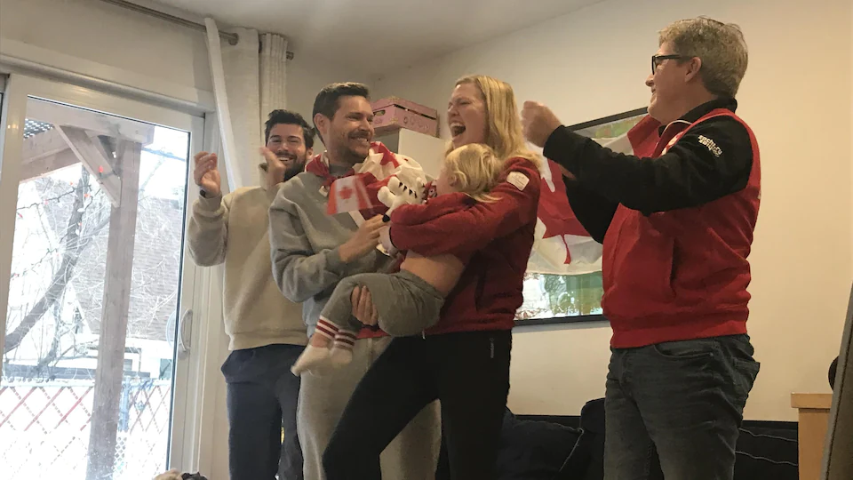 Relatives and friends of Charles Hamlin are elated after the victory of the Canadian short track relay.