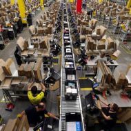 Employees work in the Amazon warehouse.
