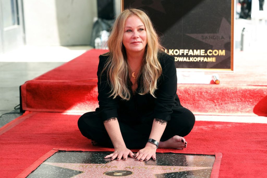 Christina Applegate, who has MS, cries during the inauguration of her star on the Walk of Fame